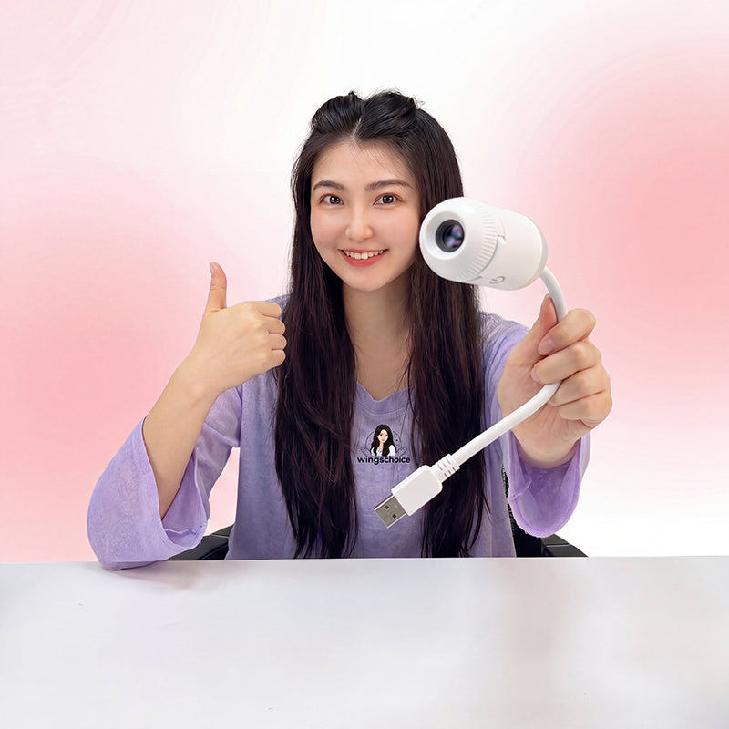 Woman holding the compact galaxy projector night light