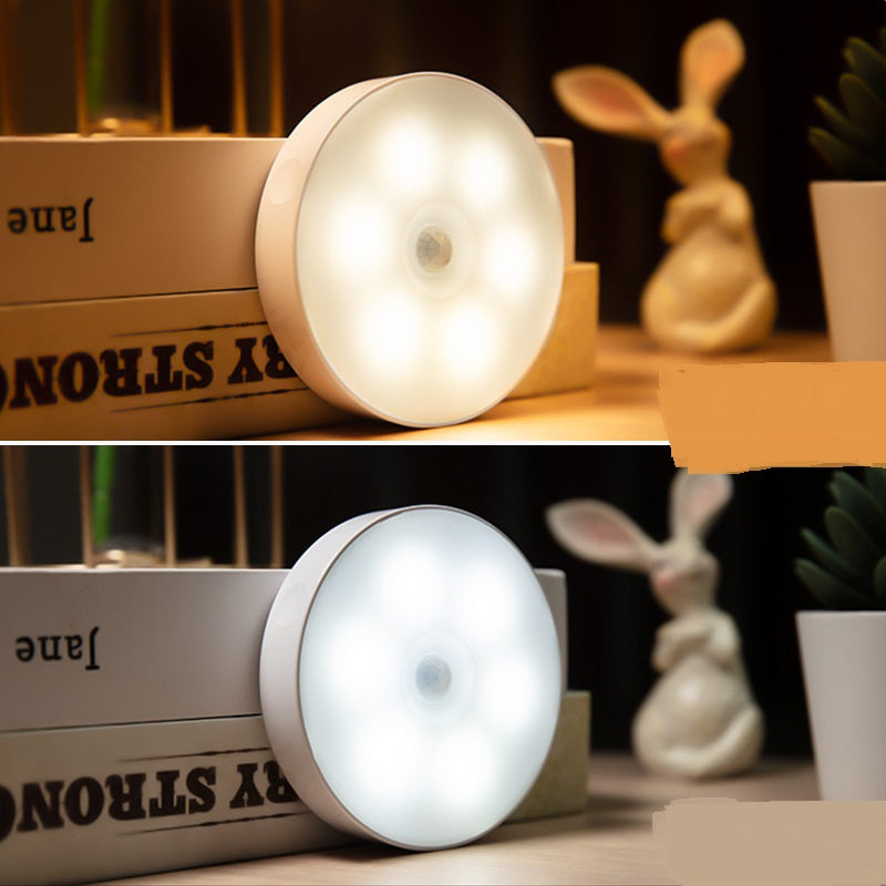 Motion sensor lights mounted on a bookshelf in warm and cool white