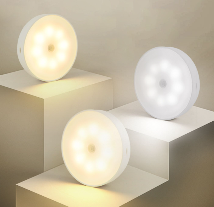 Three magnetic motion sensor lights on white steps