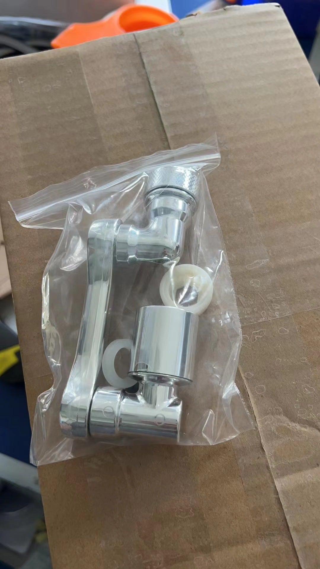 Rotating tap extender in its packaging