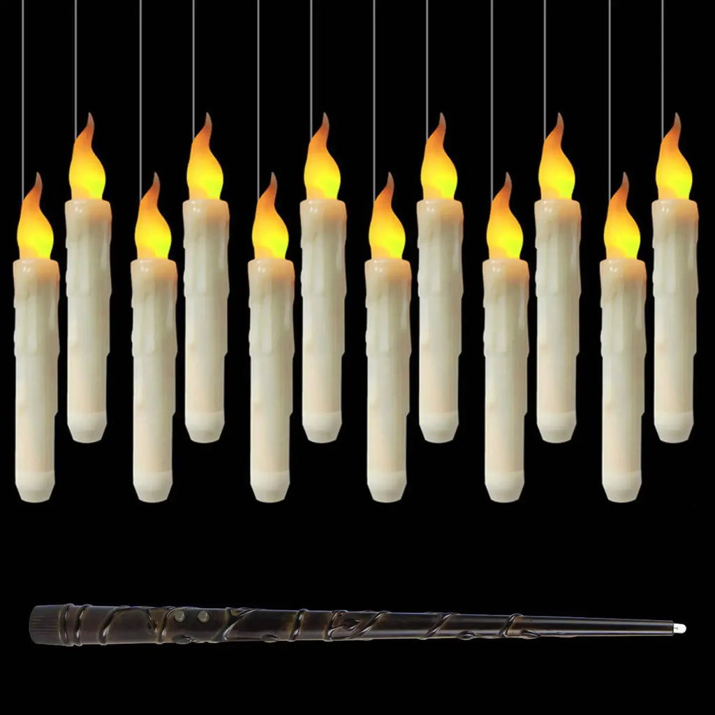 Floating LED candles hanging lit against a black background