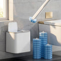 No-touch disposable toilet brush with wall-mounted dock and stacked scrub heads in a modern bathroom