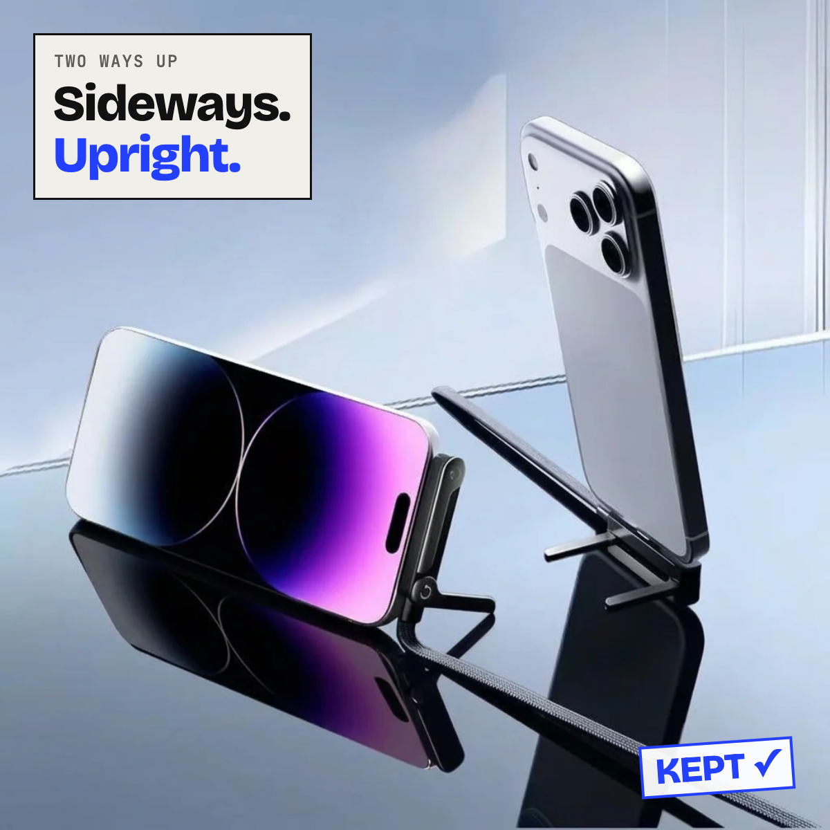 Phones propped sideways and upright on the cable stand