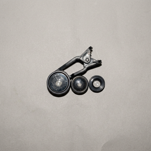 Clip-on phone lens kit with a scratched lens