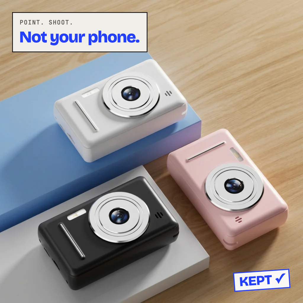 Retro digital cameras in black, white and pink