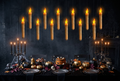 Floating LED candles above a Halloween dinner table